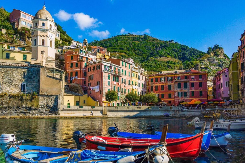 cinque terre sunset harbor boats evening glow