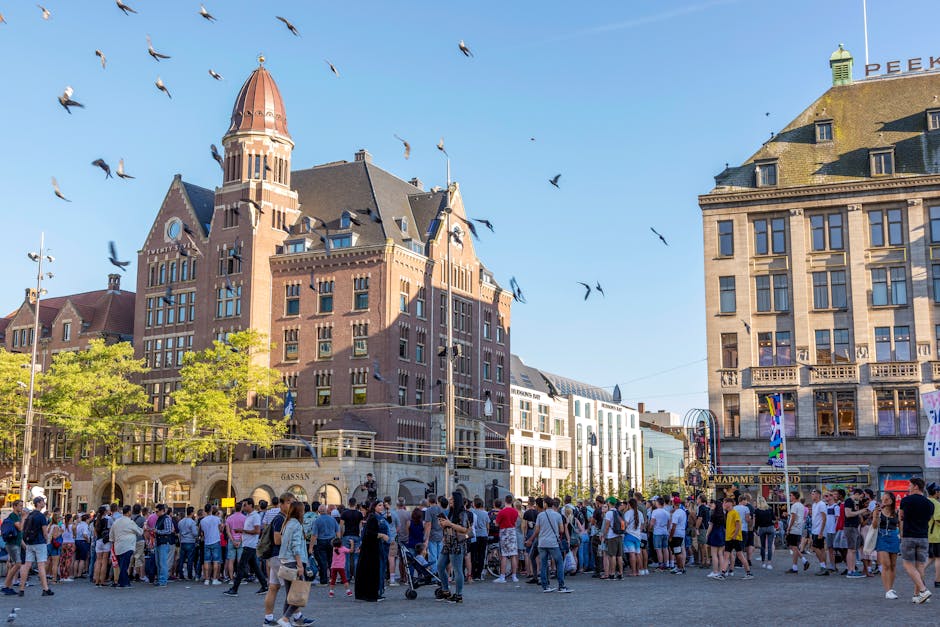 Crowd celebrating King’s Day on Dam Square, Amsterdam