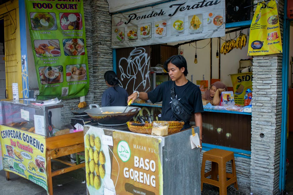 banconi del mercato Albert Cuyp con nasi goreng da asporto