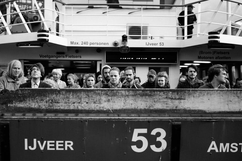 Festival crowd at the NDSM Wharf entrance with ferry in foreground