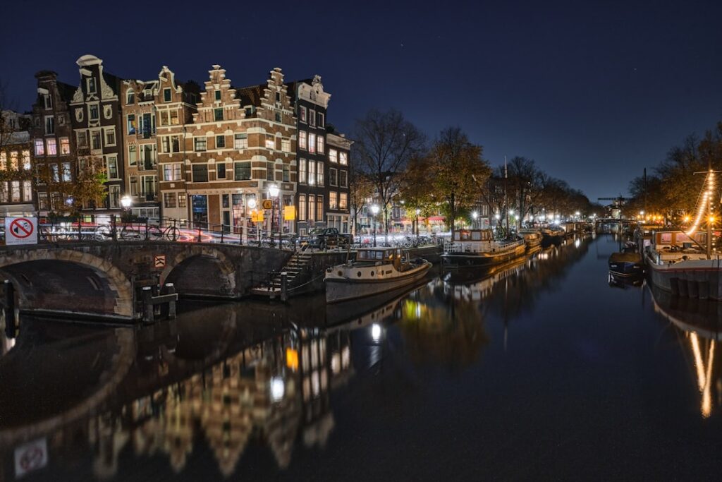 De Wallen at night with canal reflections