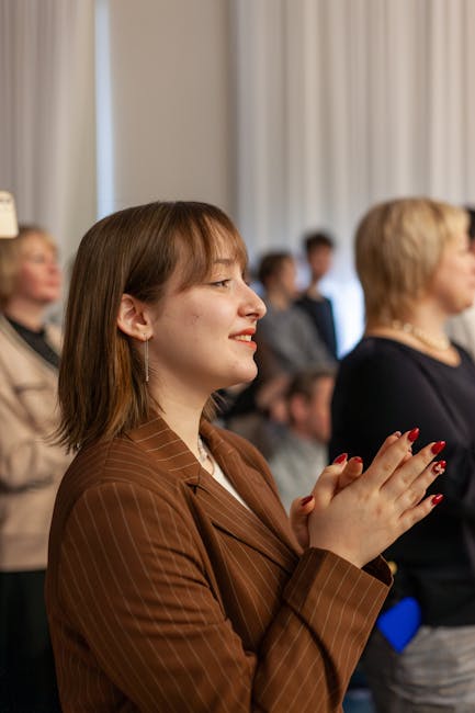 Audience applauding inside a concert hall