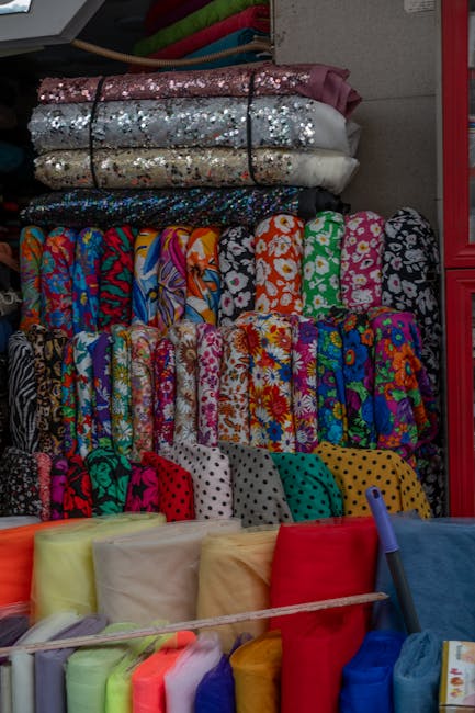 Colorful fabric stalls at Bijlmer market on Bijlmerplein