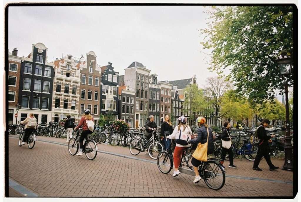 Crowded bicycle lane on a canal bridge in Amsterdam
