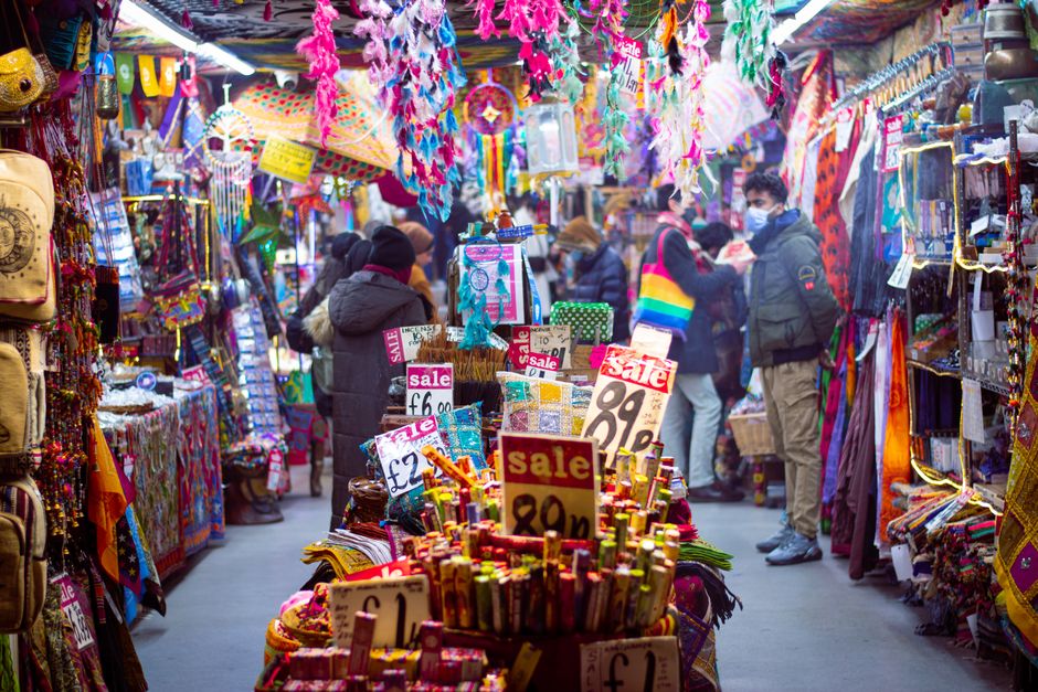 Camden Market busy canal walkway with stalls and shoppers