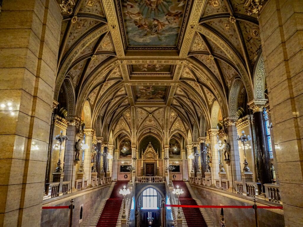 Interior golden hall of the Hungarian Parliament on a guided tour