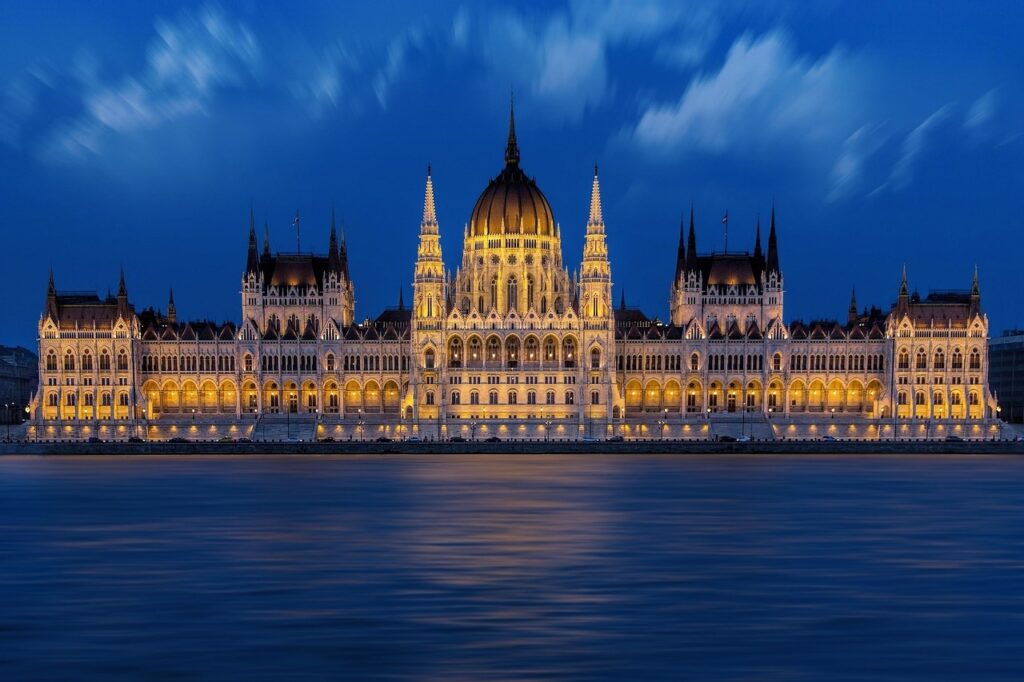Hungarian Parliament building with river view at sunset