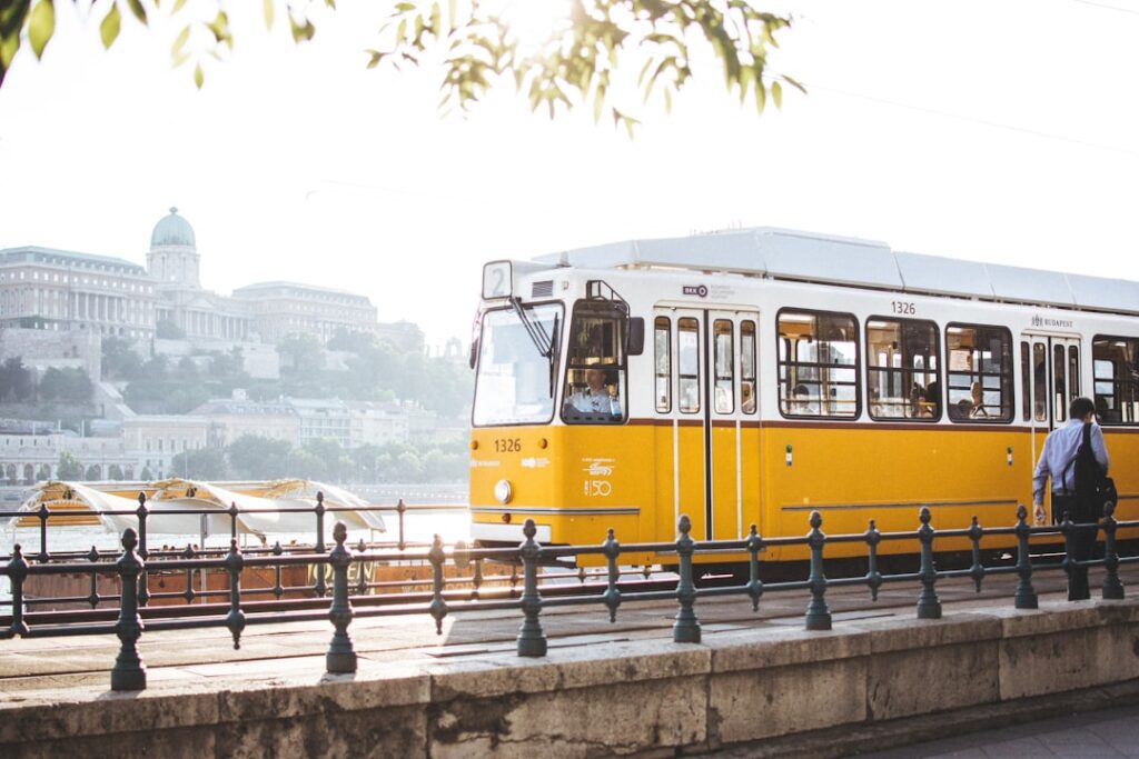 Tram 2 riverside view with passengers at sunset