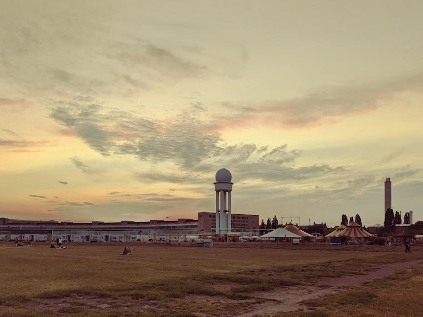 Sunset over Tempelhofer Feld with people on the grass