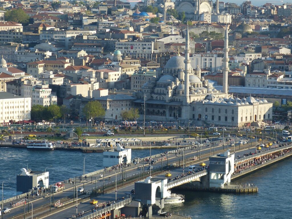 Galata Bridge with fishermen and a view of the Bosphorus by day