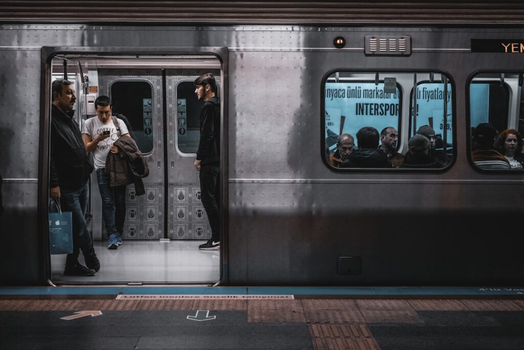 Passengers boarding a modern metro train on an Istanbul platform
