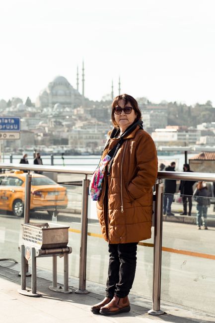 Istanbul street scene with people wearing jackets and scarves in autumn
