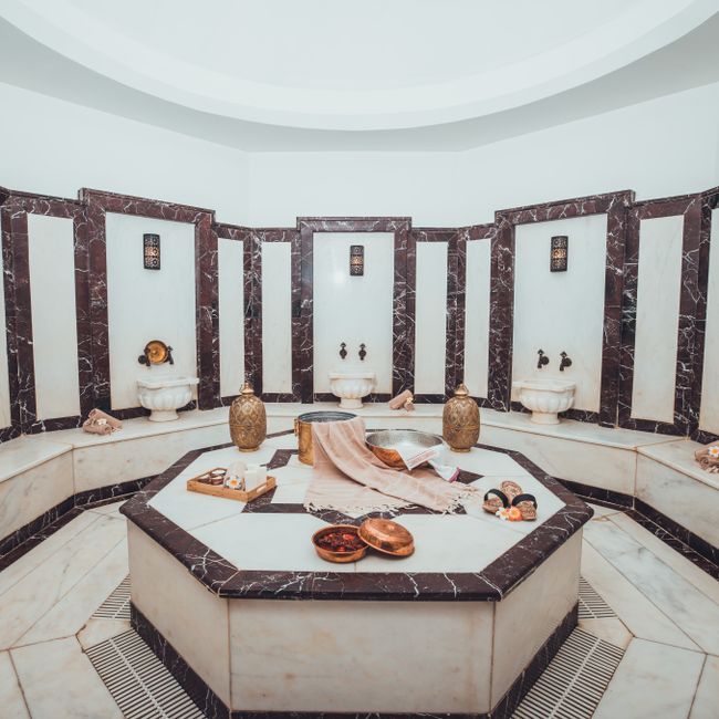Traditional Turkish hammam interior with marble bathing room