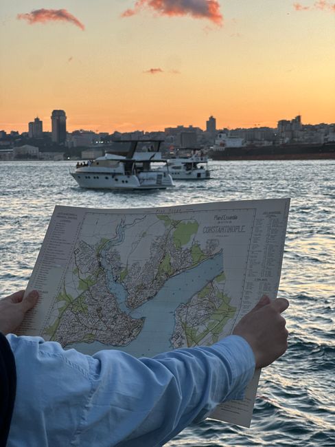 Traveler overlooking Istanbul skyline while holding a city map