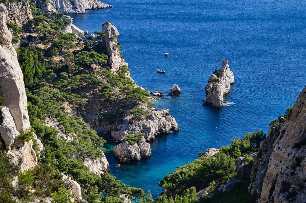Hidden Mala cove at Cap d'Ail with pine-covered cliffs