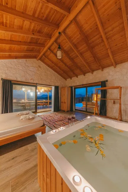 Przytulny pokój z drewnianym sufitem i jacuzzi na tarasie niedaleko Pizy