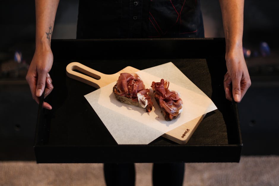Modern smorrebrod plated on a wooden board at Aamanns