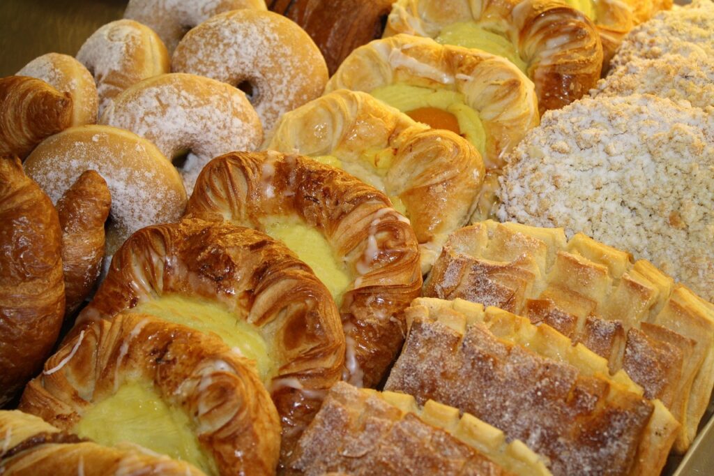 Danish pastries in a takeaway bag on evening streetscape