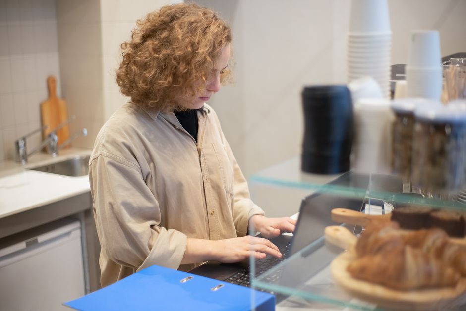 Barista kneading pastry inside Democratic Coffee