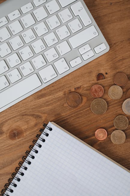 Food budget planning notebook with euros and coins for Copenhagen travel