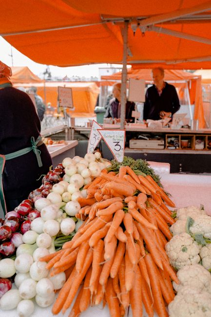 Outdoor market vendors selling fresh vegetables at Israels Plads
