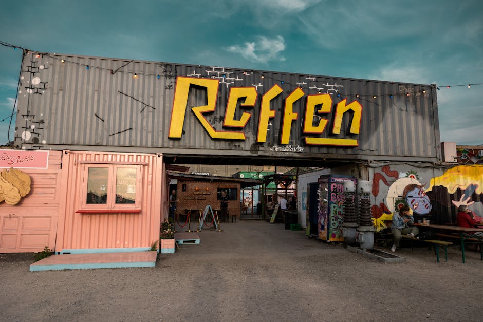 Food trucks at Reffen street food with industrial harbor view