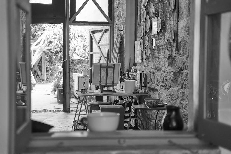Small artist studio with open door and painting supplies
