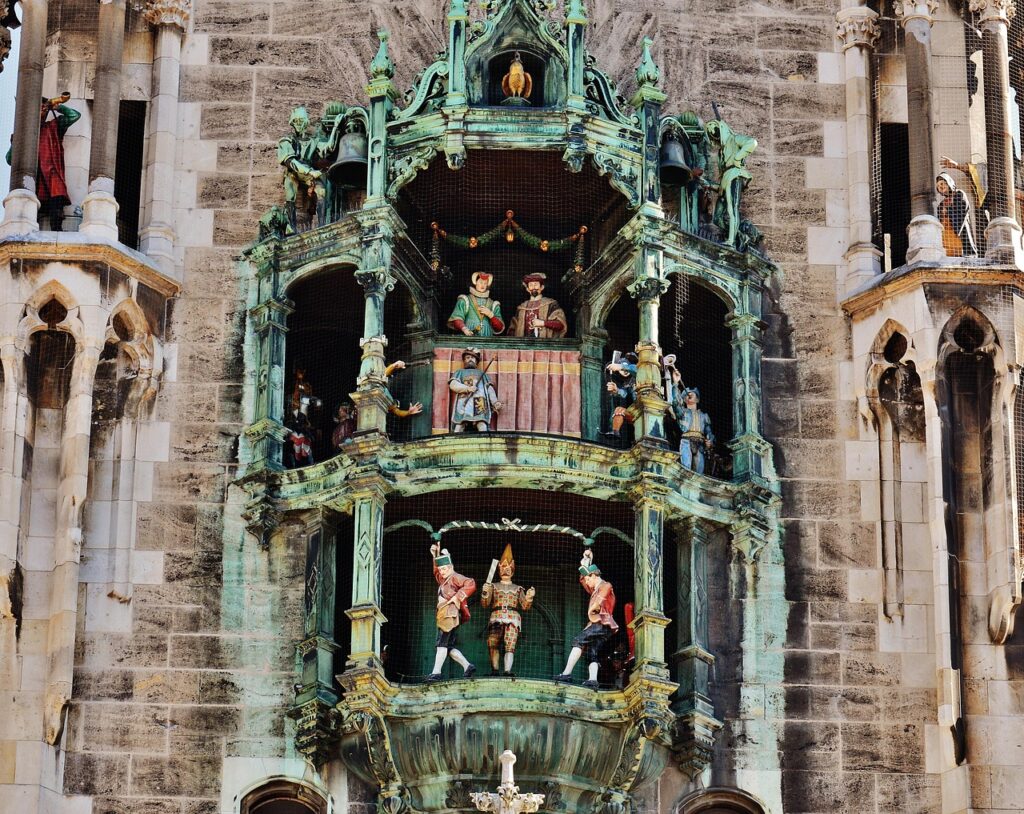 Marienplatz central square with tourists watching the Glockenspiel