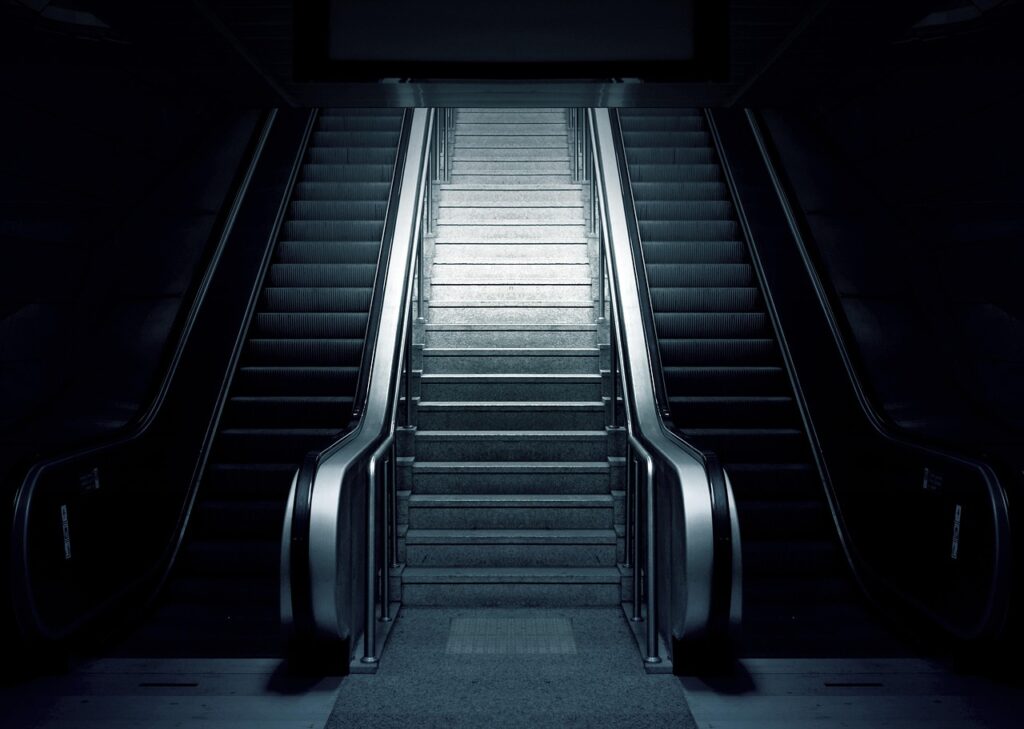 U-Bahn stairs and escalator crowded with commuters during rush hour