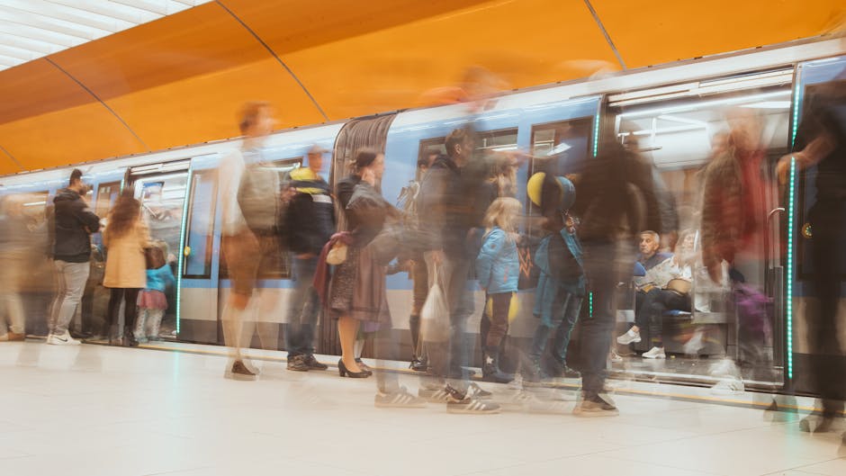 U-Bahn platform busy with commuters and digital displays