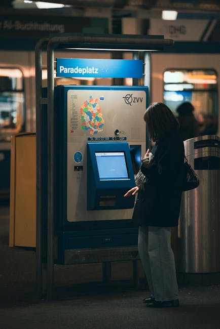 MVV ticket machine at a Munich station with a passenger