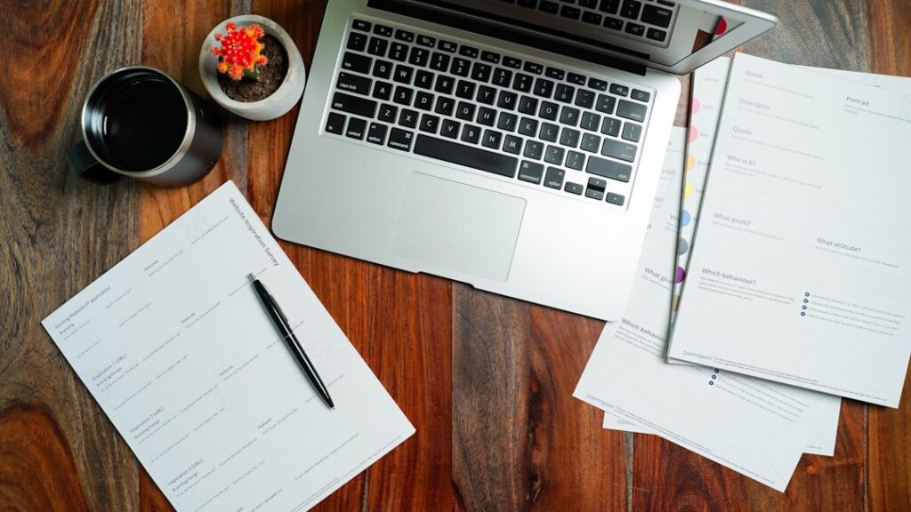 Office desk with laptop and German tax forms
