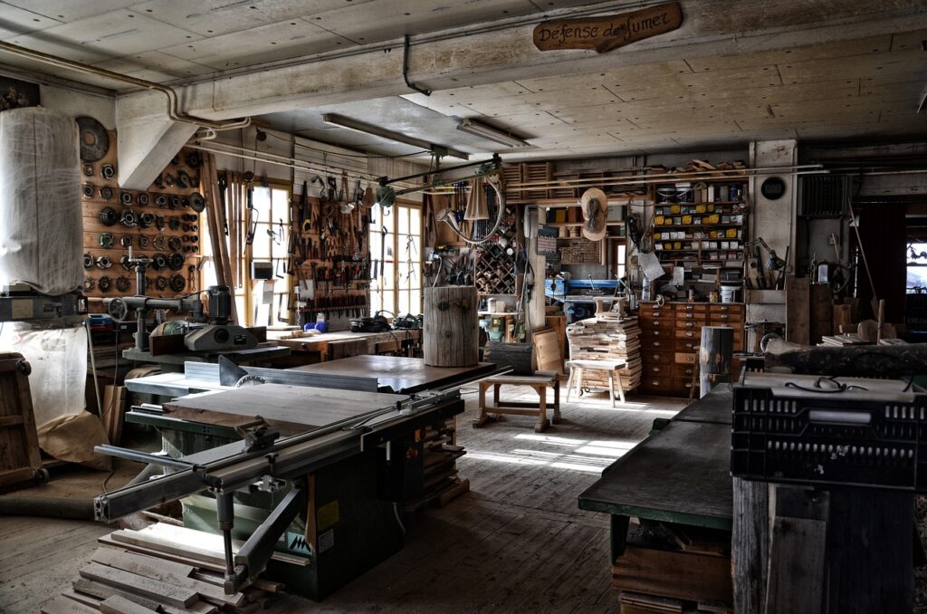 Historic artisans' workshop with tools and machines on display