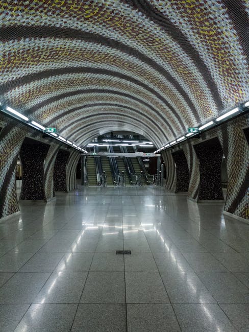 Long escalator and reflective tiles at Admiralteyskaya station