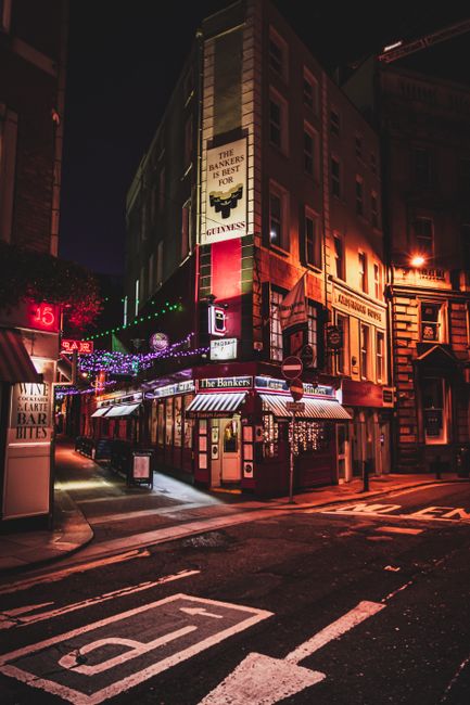 Evening pub street in Dublin lit up at night