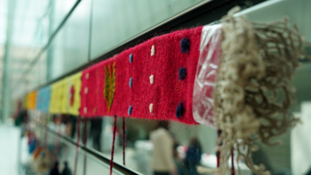 Close-up of textile weaving pattern in museum display