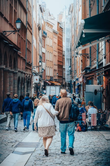 Vieux Lyon cobbled street with tourists and shops