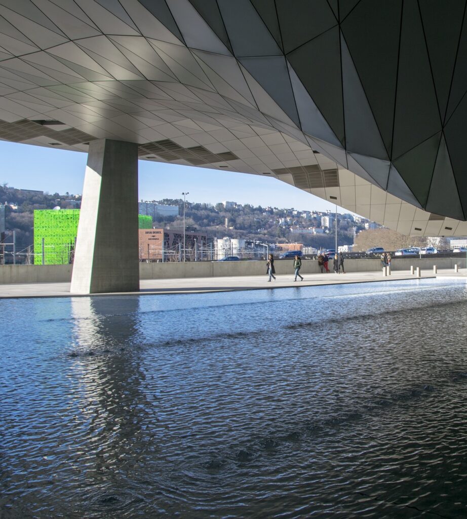 Glass architecture of the Confluence Museum during the day