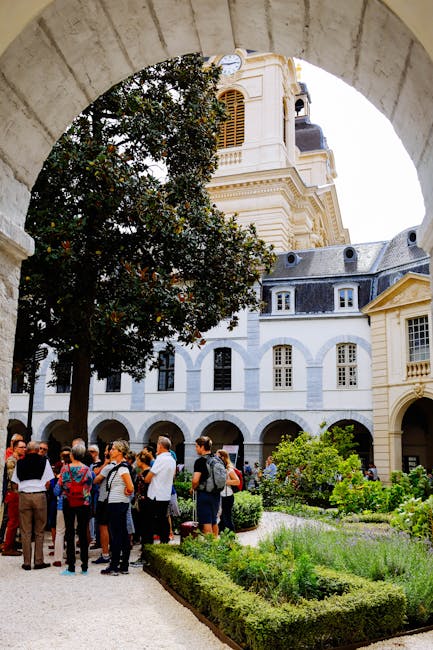 Visitors in the interior courtyard following a guided itinerary