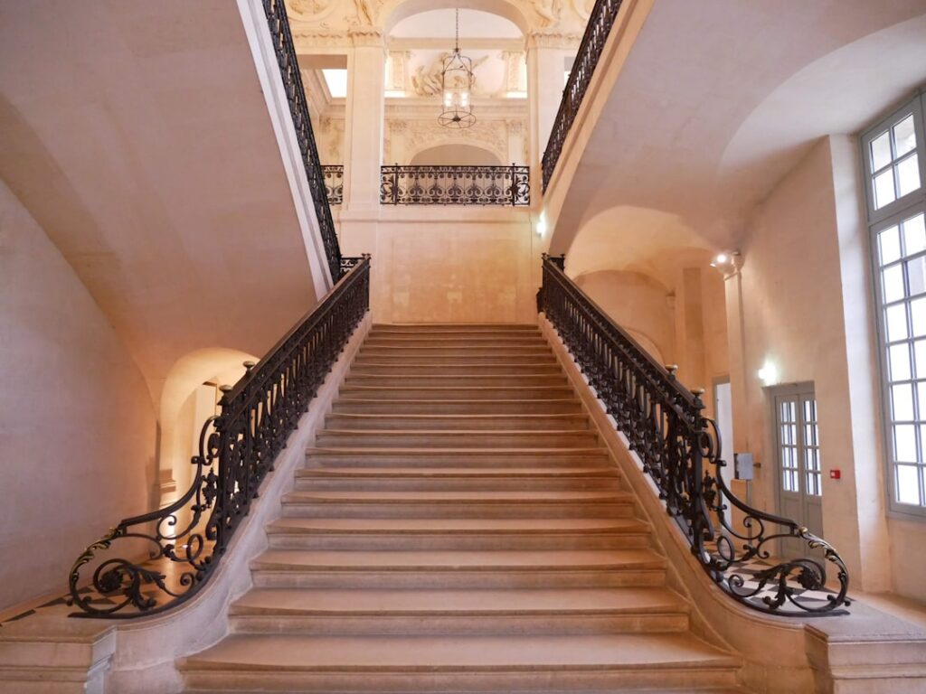 Interior carved stone staircase at the Gadagne Museum