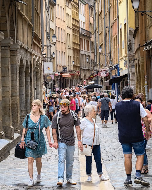 Medieval Lyon street near Place du Petit Collège with tourists