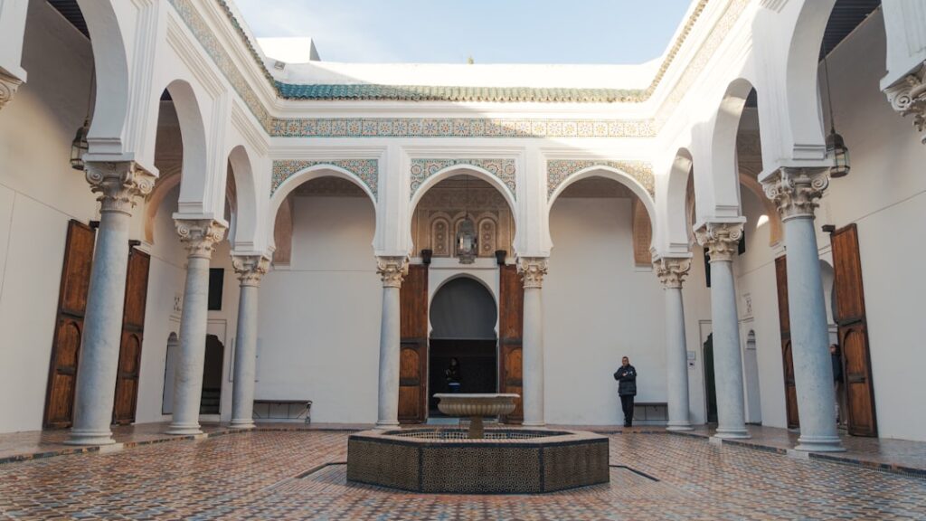 Visitors enjoying the museum courtyard at golden hour