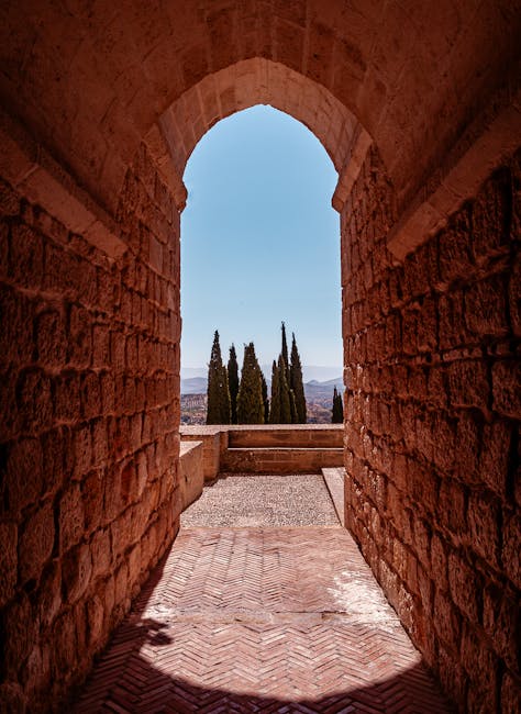 Sunlit stone archway at the Alcazaba