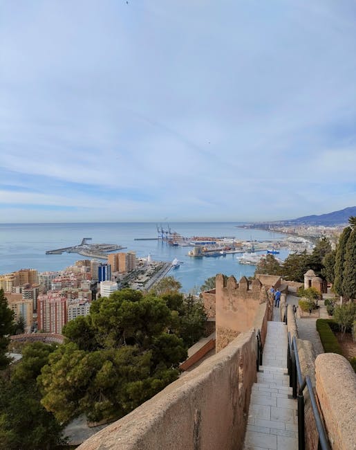 Gibralfaro Castle panoramic view over Malaga harbor at sunset