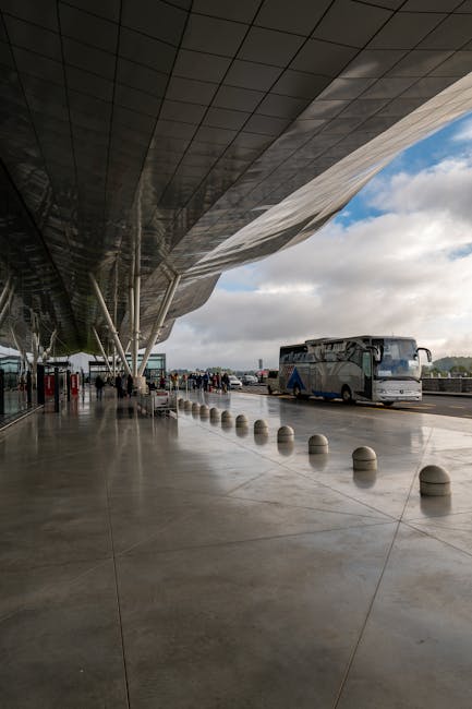 Passengers waiting at Malaga airport bus stop
