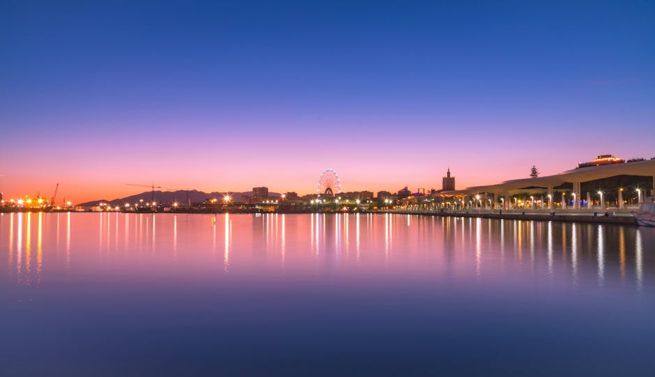 Sunset view of Málaga port and the Muelle Uno promenade