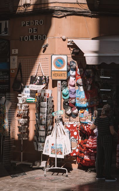 Tourists browsing souvenir stalls on a shopping street
