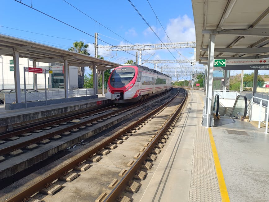 Cercanías train arriving at Málaga airport station platform