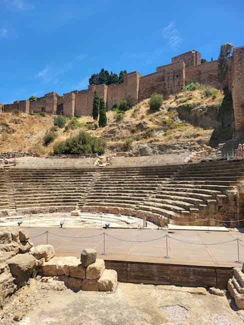 Roman theatre in Málaga with the Alcazaba rising behind it