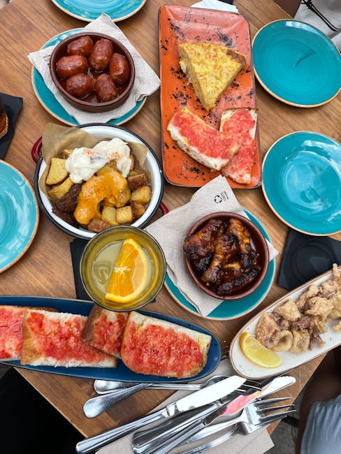 Outdoor tapas plates at El Pimpi restaurant, Granada 62